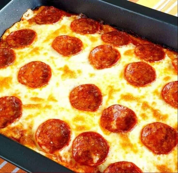 Keto Pizza Casserole baked and garnished with cheese and pepperoni