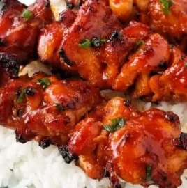 Grilled Korean Chicken Skewers served on a platter with garnish