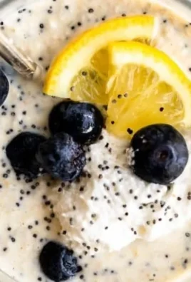 Lemon Poppy Seed Vegan Overnight Oats in a bowl with toppings