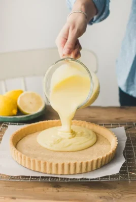 Delicious lemon tart with a golden crust and fresh lemon slices