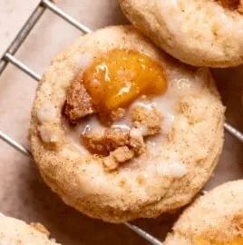 Freshly baked Peach Cobbler Cookies on a rustic wooden table