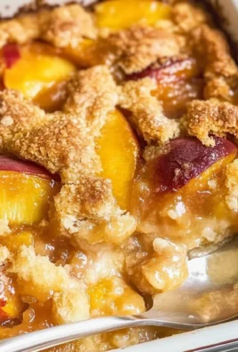 Delicious Peach Cobbler with Fresh Peaches served in a rustic dish