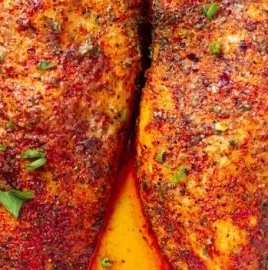 Juicy and tender perfect oven baked chicken breast on a plate