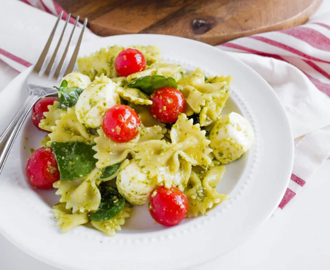 Pesto Caprese Pasta Salad with fresh tomatoes and mozzarella cheese