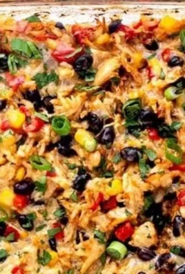 Delicious Protein Burrito Casserole served in a dish, garnished with toppings.