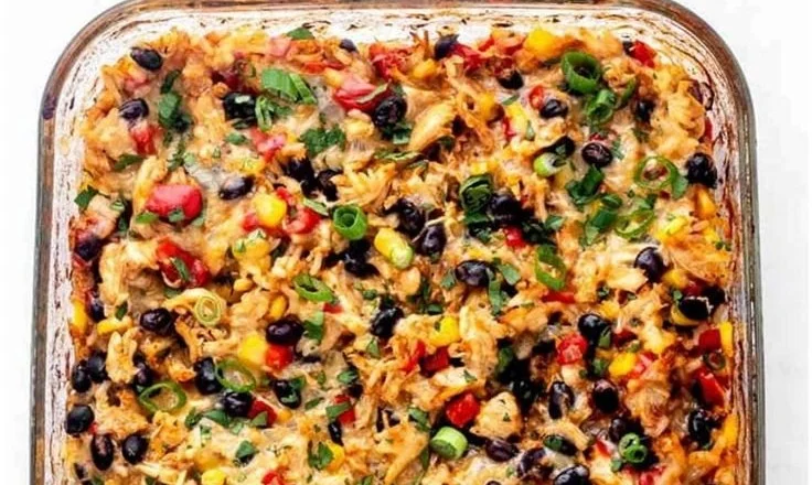 Delicious Protein Burrito Casserole served in a dish, garnished with toppings.