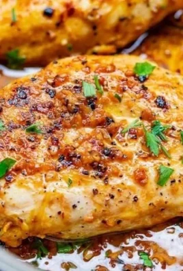 Plate of simple garlic butter chicken garnished with fresh herbs