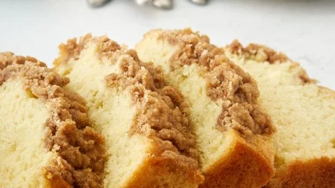 Sour cream coffee cake loaf with a golden crust and crumbly topping