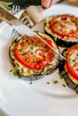 Delicious Spanish roasted garlic eggplant served with herbs and spices.