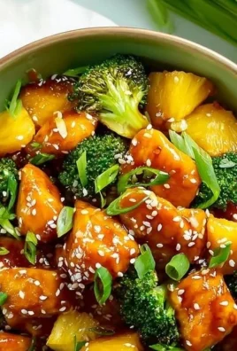 Teriyaki Chicken with pineapple and broccoli on a sheet pan dinner.