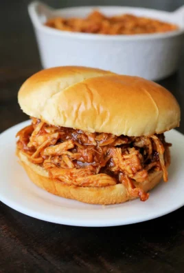 Delicious pulled BBQ chicken cooked in a Crockpot