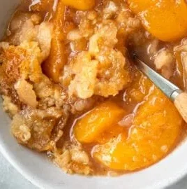 Easiest Southern peach cobbler with fresh peaches and golden crust.