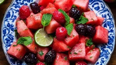 Fresh watermelon salad with lime mint dressing in a bowl